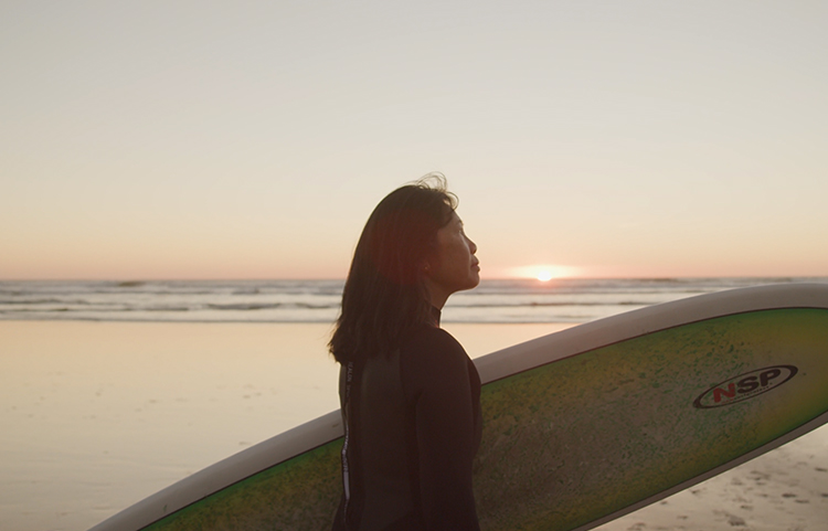 Woman with surfboard